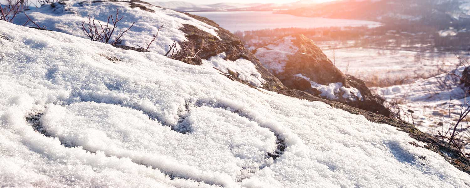 Snowy heart on a hill.