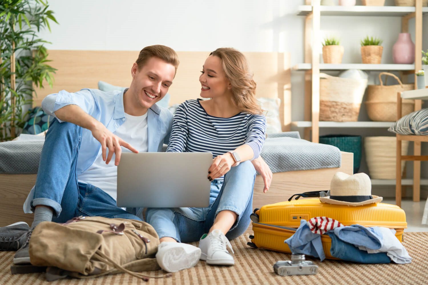 Photo of couple using laptop to look for the best Utah vacation rental