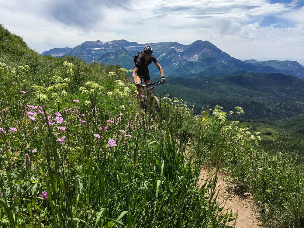 Photo of a person on a mountain trail in Utah