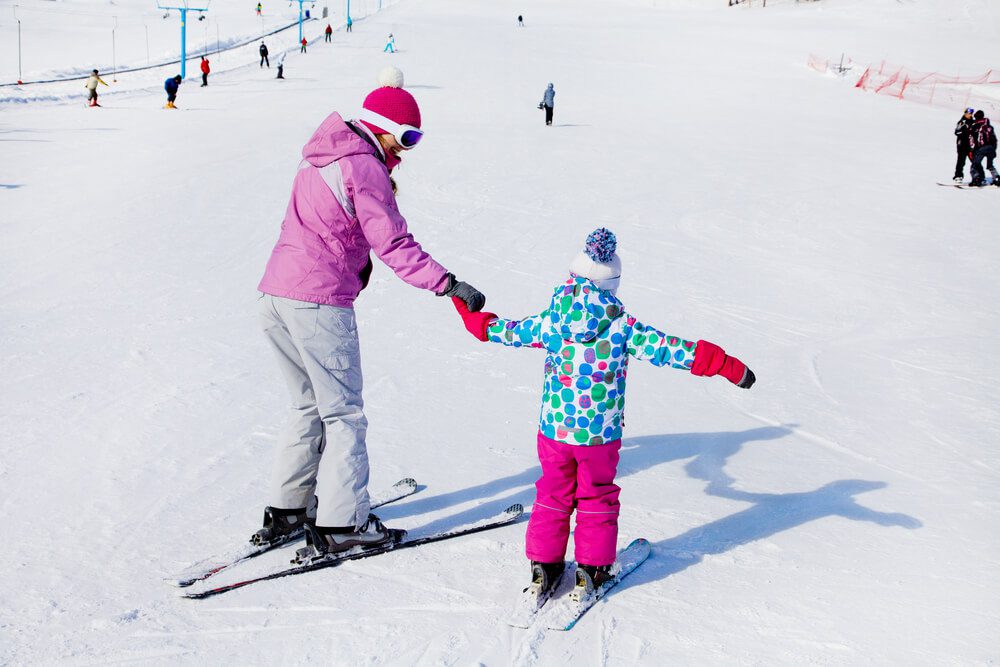 Photo of parent and child during a Snowbird ski lesson