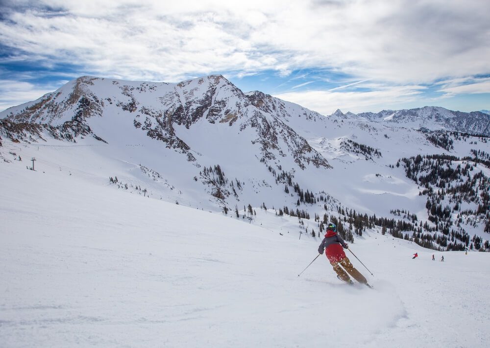 Photo of person skiing in Little Cottonwood Canyon: Alta vs Snowbird