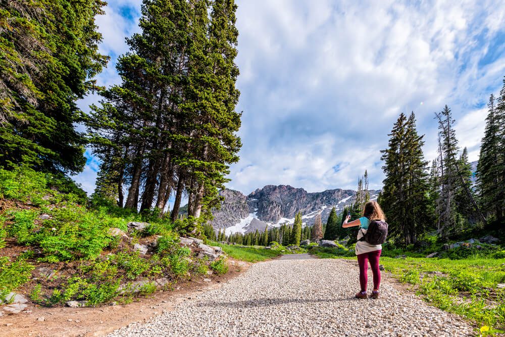 Photo of a person hiking during a Utah summer vacation in Alta-Snowbird