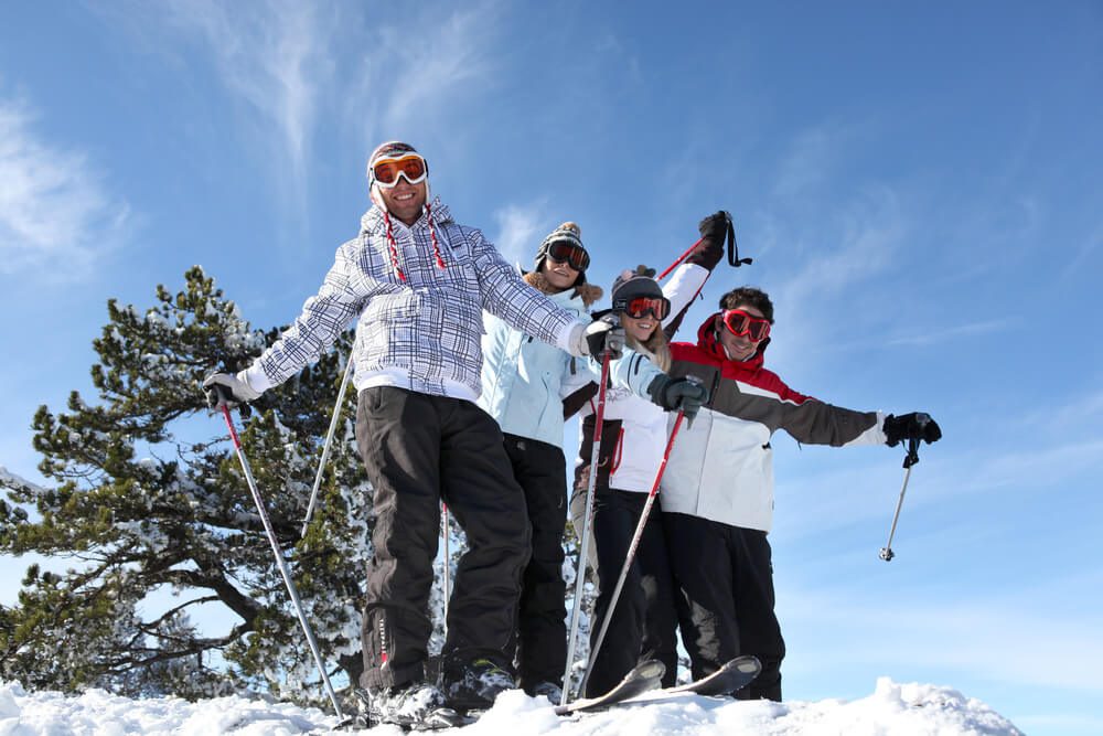 Family enjoying spring skiing before the Snowbird closing date