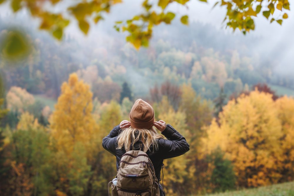 Person on a fall hike in Utah's Little Cottonwood Canyon
