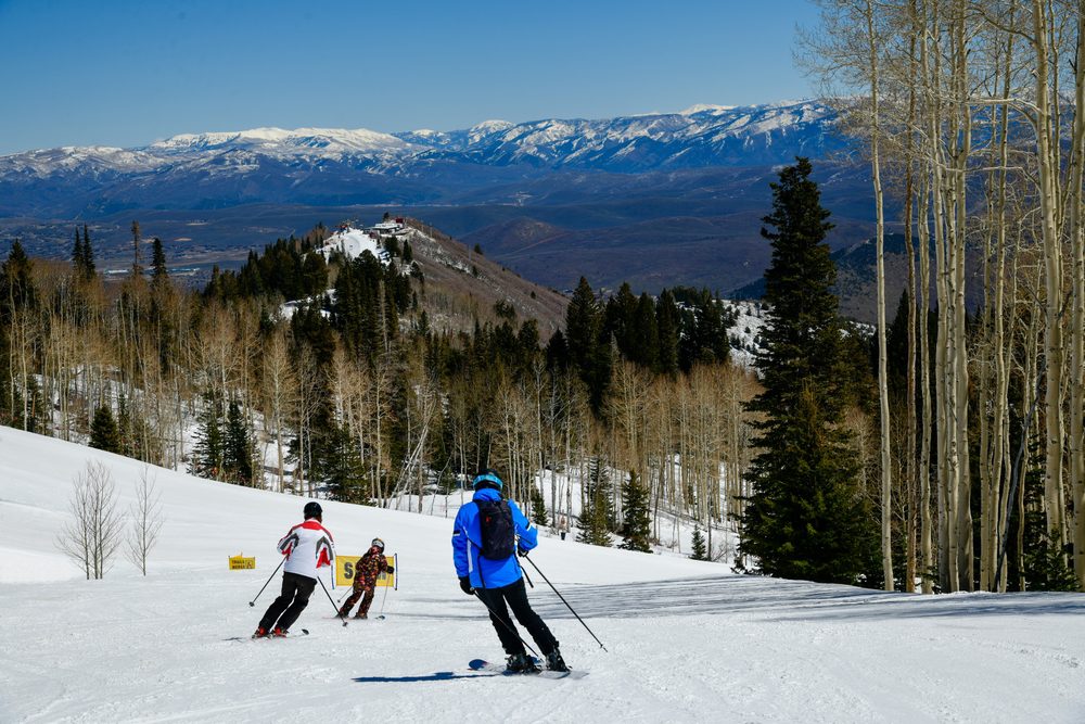 People skiing Snowbird on a clear spring day