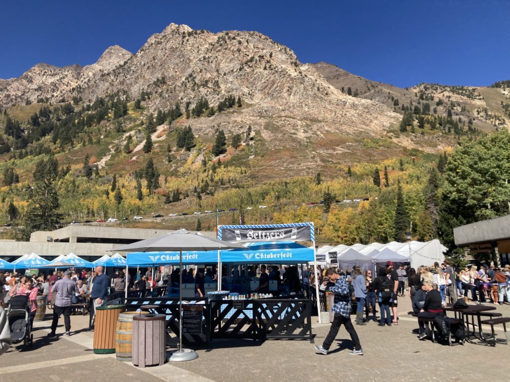 beer tents against a mountain backdrop at Oktoberfest in Snowbird Utah
